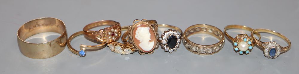 Six assorted 9ct rings, including wedding band and gem set, a yellow metal and gem set ring and two costume rings.